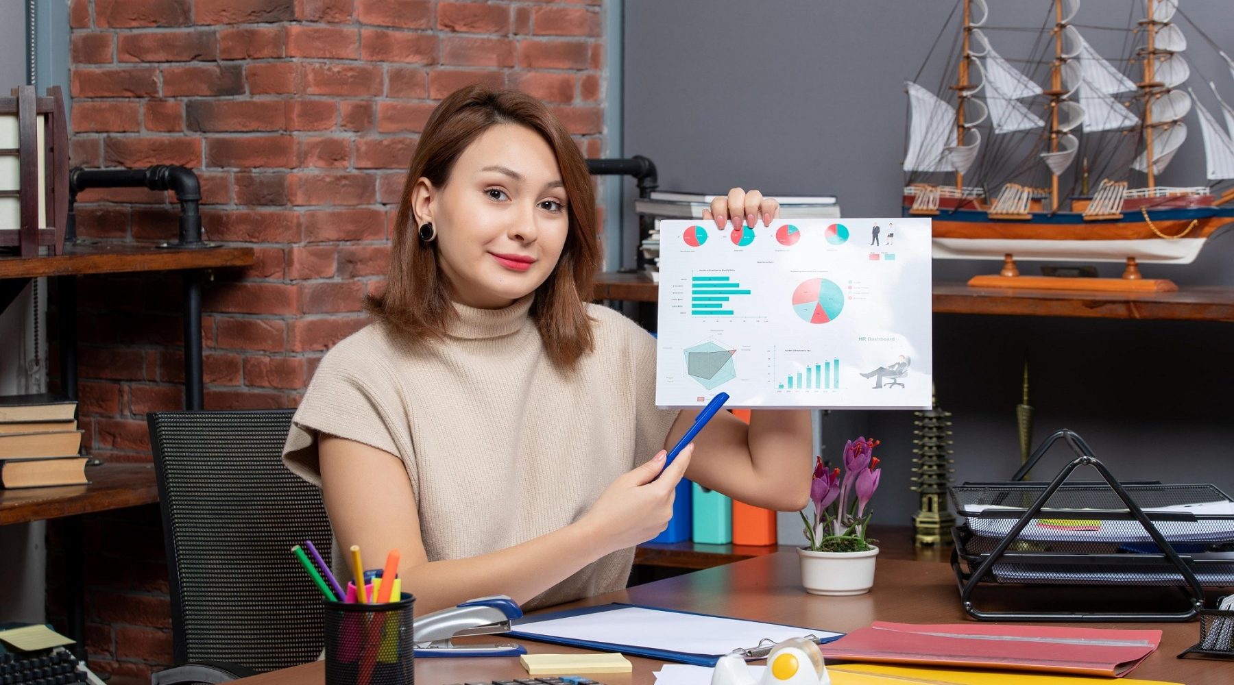 front-view-pretty-woman-showing-diagrams-working-office